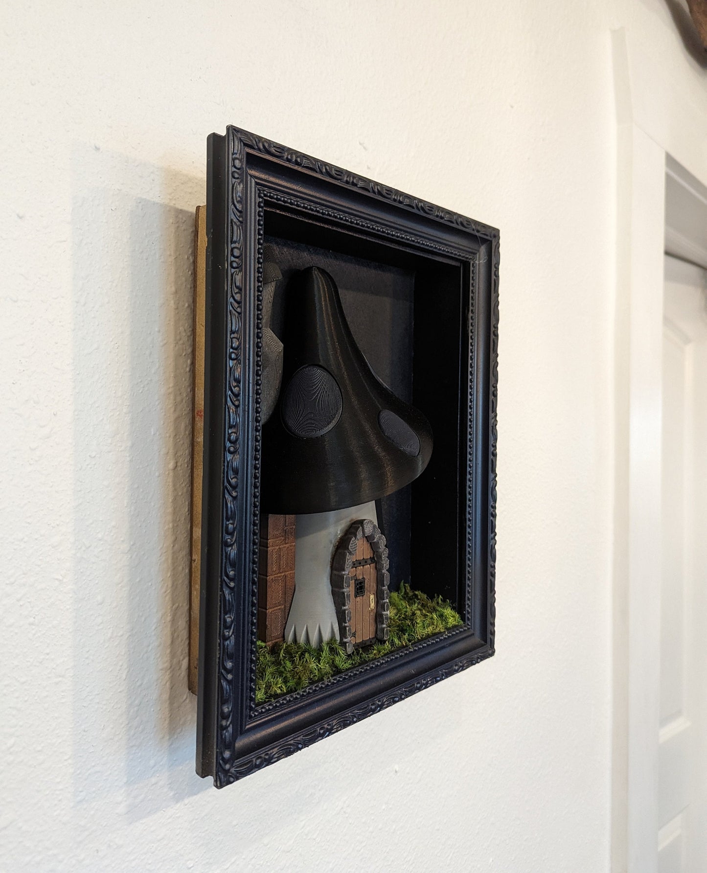 Gothic mushroom house in shadowbox frame.