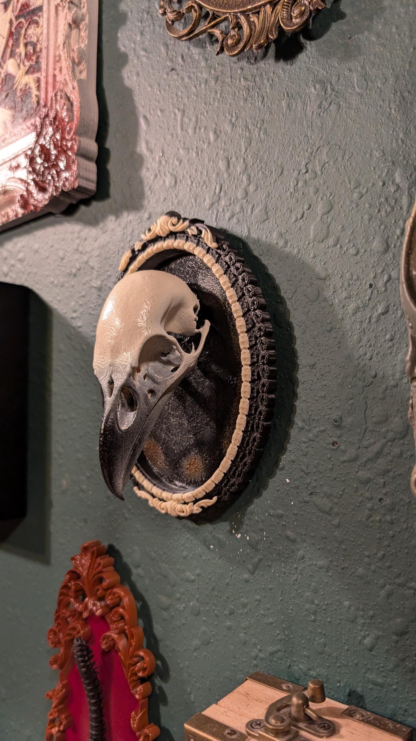 Raven skull replica in Gothic ornate frame
