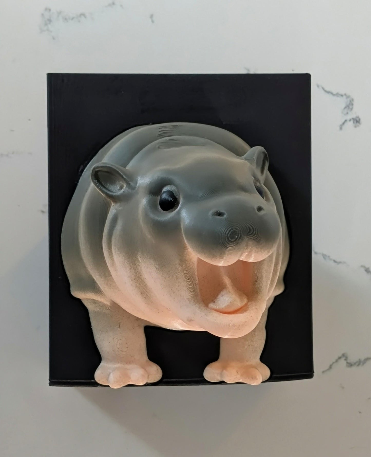 Custom Moo Deng, the pigmy hippo bookend.