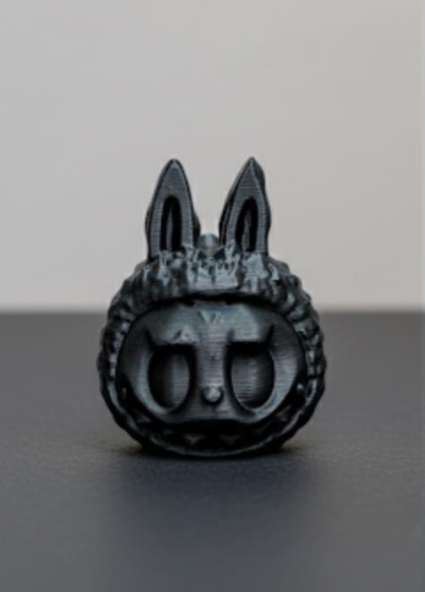 Blacked-out Labubu death whistle. Sounds scary AF or your money back.