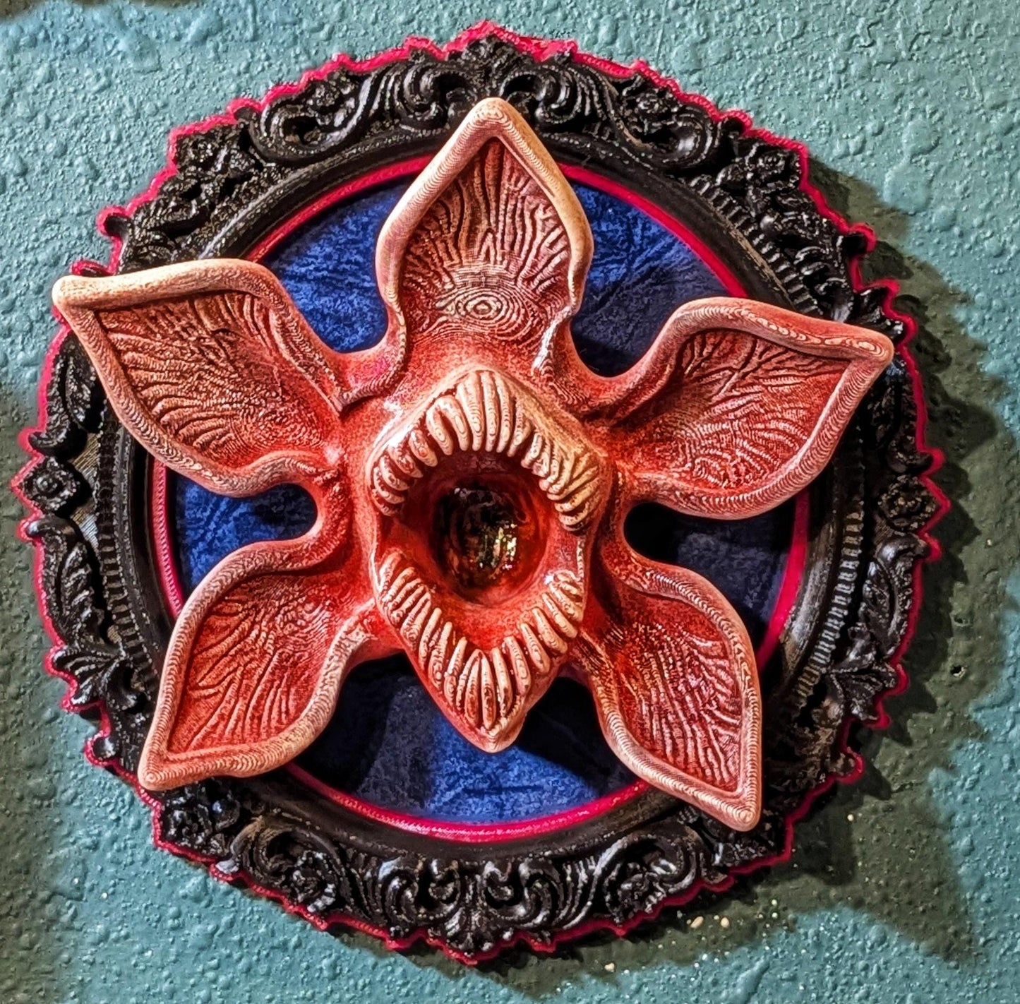 Demogorgon art piece in baroque frame